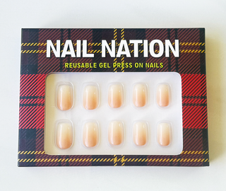 Box of Nail Nation reusable gel press-on nails with tartan design