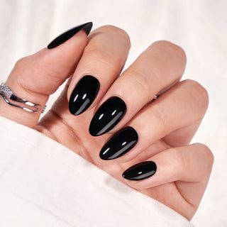 Hand with black nail polish on a white background