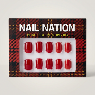 Box of Nail Nation reusable gel press on nails with red nails on a plaid patterned background