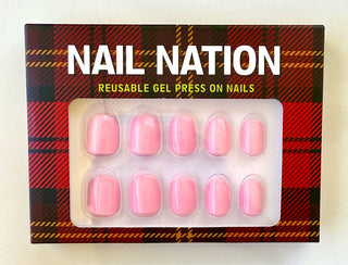 Nail Nation reusable gel press on nails packaging with pink nails and plaid design.