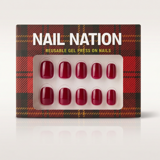 Nail Nation reusable gel press on nails packaging with red nails on a plaid background