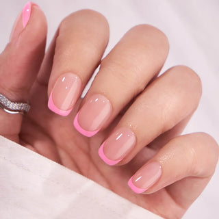 Close-up of a hand with pink nail polish on a white background