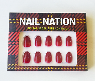 Box of Nail Nation reusable gel press-on nails with tartan design