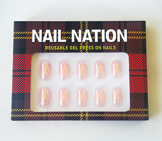 Box of Nail Nation reusable gel press-on nails with tartan design
