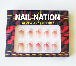Box of Nail Nation reusable gel press-on nails with tartan design