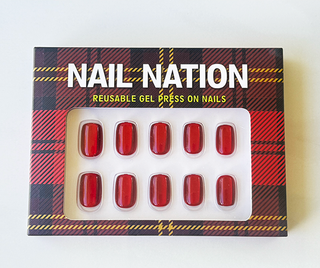 Box of Nail Nation reusable gel press-on nails with tartan design