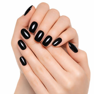 Close-up of hands with black nail polish on a white background