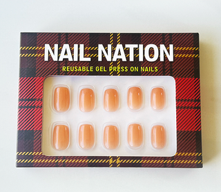 Box of Nail Nation reusable gel press-on nails with tartan design