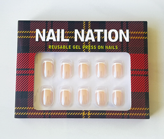 Box of Nail Nation reusable gel press-on nails with tartan design